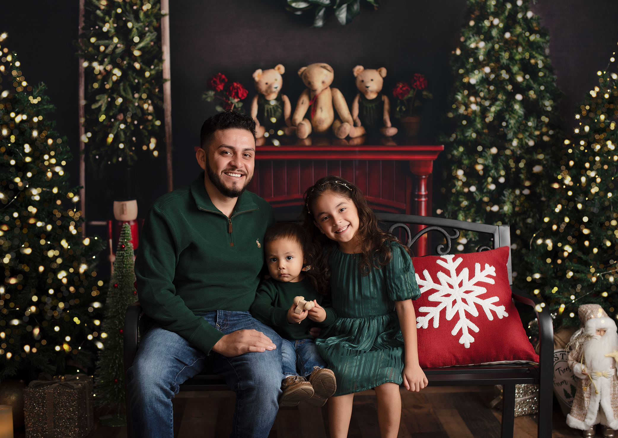 dad photographed with boy and girl during Christmas time in Charleston